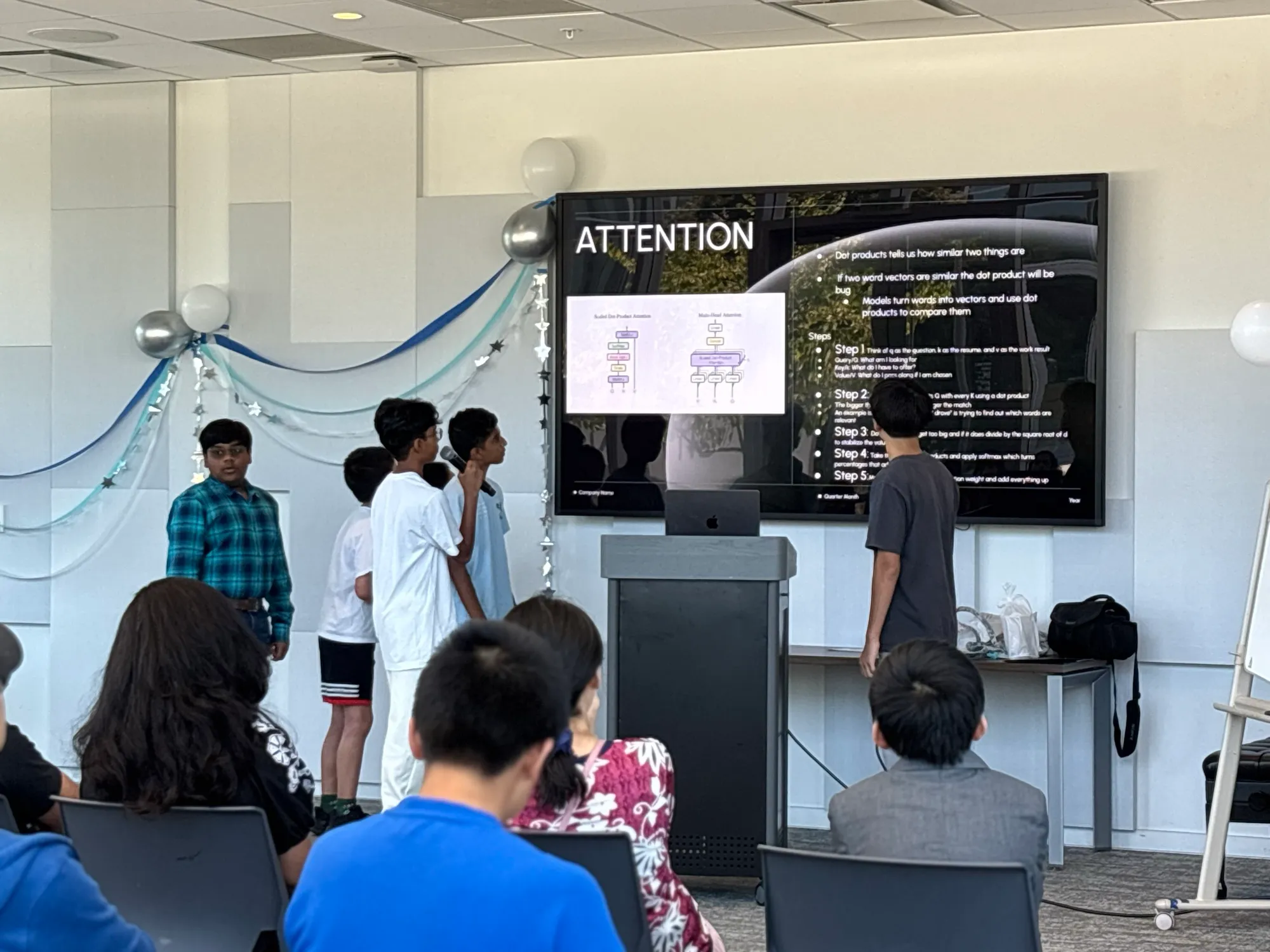 Computer Science cohort presenting Attention Is All You Need with the audience looking on.